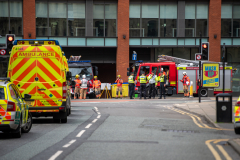 Manchester Central fire engine parked up with emergency crews stood around